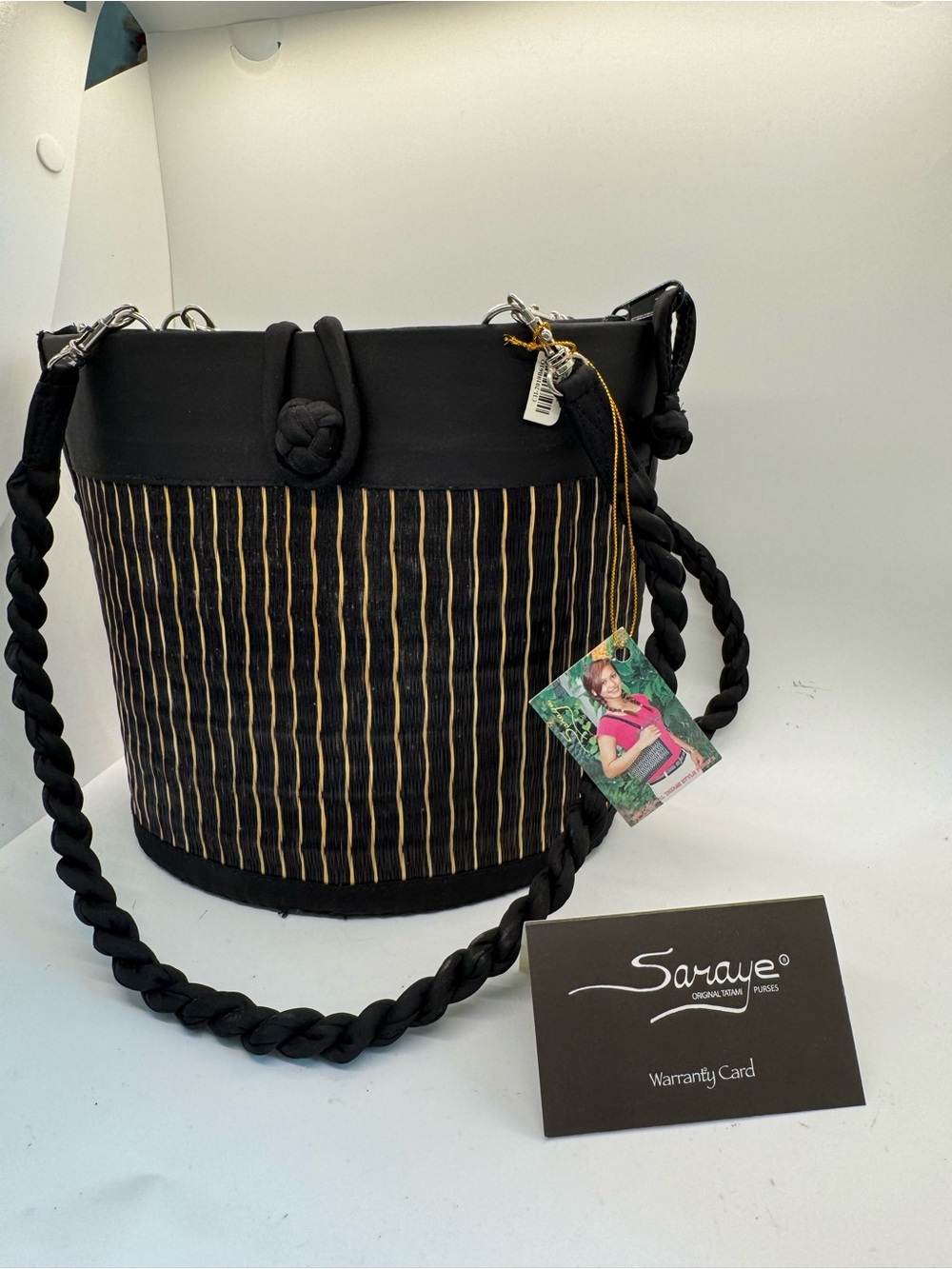 rave Black Bucket Shoulder Bag with Gold Pinstripe